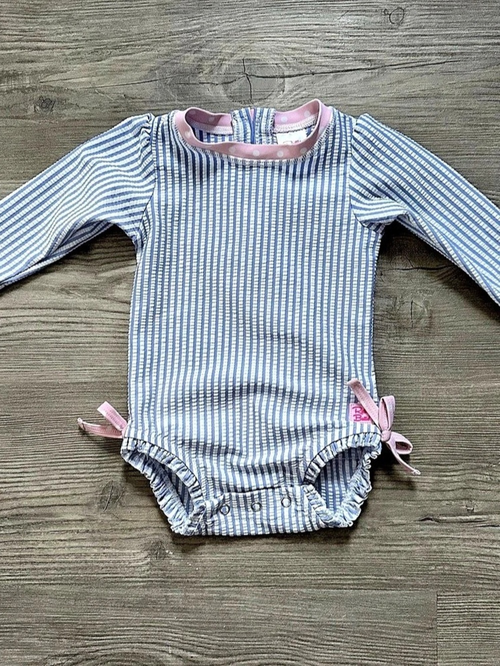 RuffleButts Seersucker Long Sleeve One-Piece swimsuit- Blue & Pink Baby 3-6M